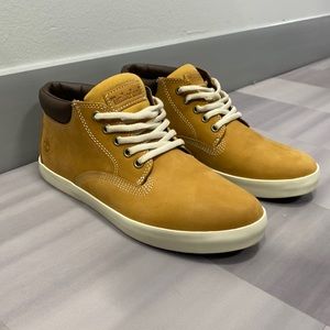 Size 9 Skyla Bay Mid Top Sneakers by Timberland. Color is Cognac